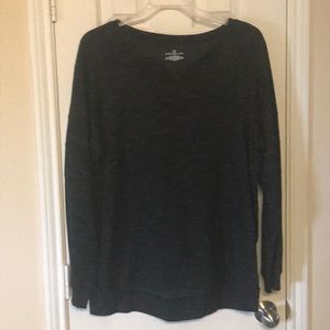 A woman’s high low V-neck sweater